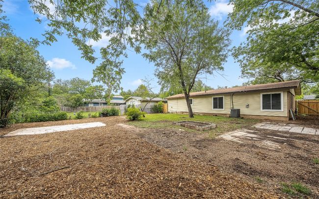 View of fenced backyard | Image 15