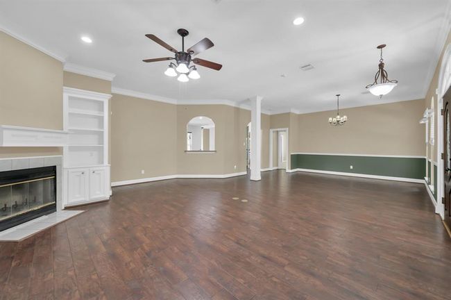 Open space concept. Living/family room on the left, Dining Room on the right. | Image 9