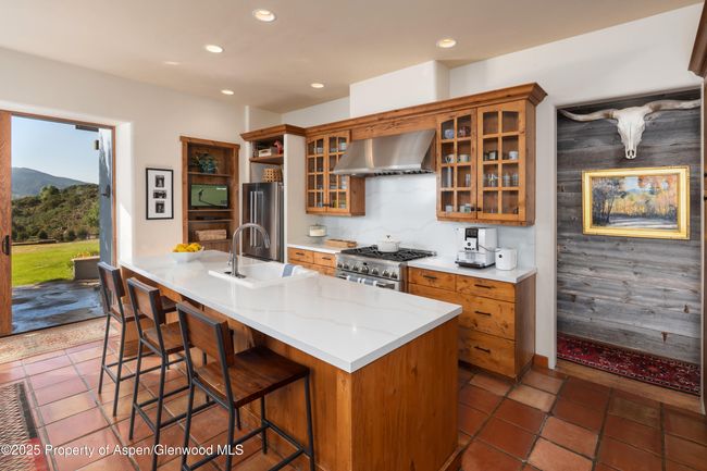 Beautiful updated kitchen with plenty of space and outdoor access. | Image 14