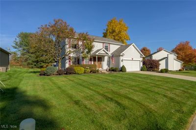 View of front of property featuring a garage and a front lawn | Image 3