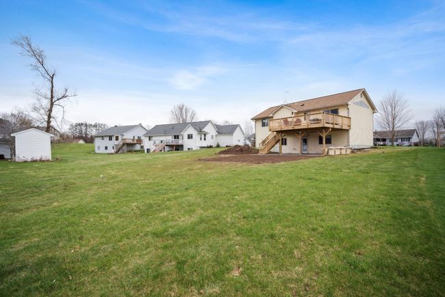 Large backyard with the new concrete patio. | Image 26
