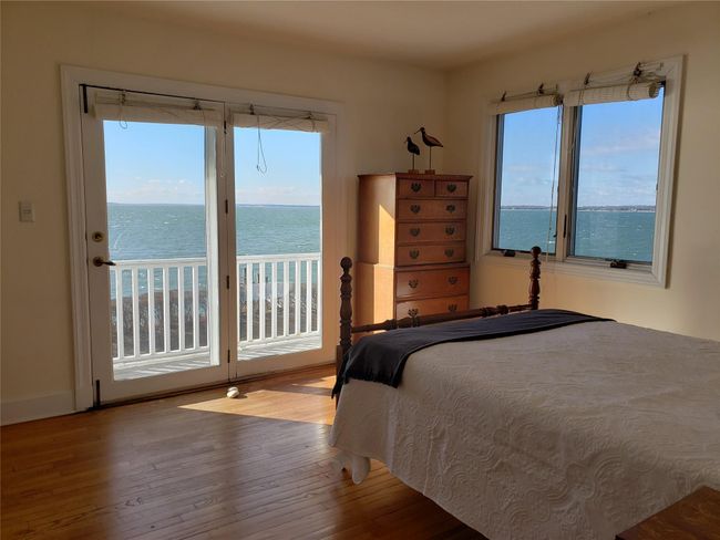 Guest Bedroom has access to balcony, waterview on two sides | Image 38