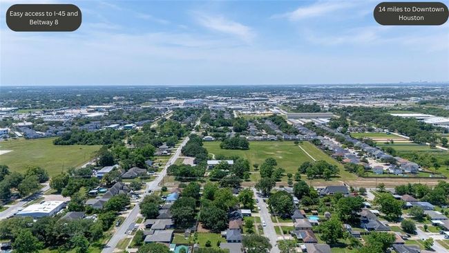 A sweeping aerial of the neighborhood places the home within its broader context — with convenient proximity to local schools, parks, shopping, and major thoroughfares. | Image 36