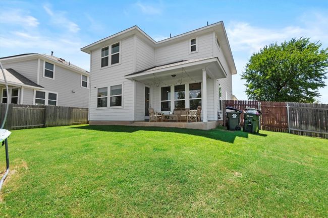 Back of property with a fenced backyard and a patio | Image 32