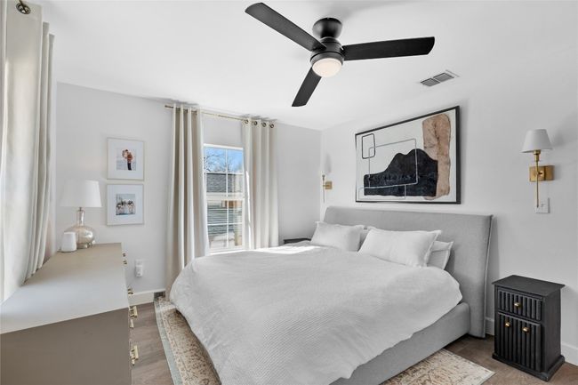 Bedroom with dark hardwood / wood-style floors and ceiling fan | Image 35