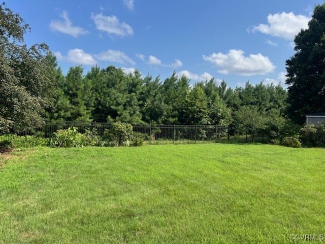 View of yard featuring a view of trees | Image 10