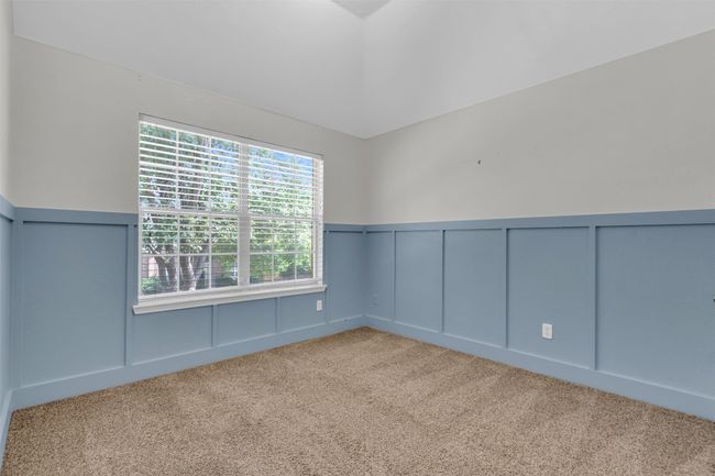 Bedroom with carpet. | Image 22