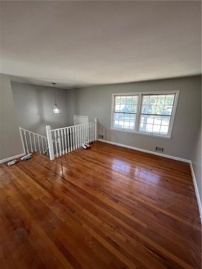 Empty room with light hardwood / wood-style flooring | Image 3