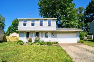 View of front of property with a front lawn and a garage | Image 1