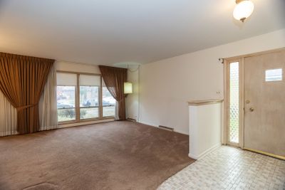 Living room with entry foyer | Image 3