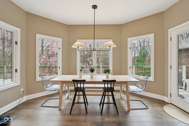 dining area featuring dark wood finished floors, baseboards, and breakfast area | Image 18