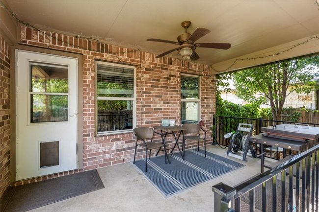 View of patio / terrace with a ceiling fan and gate | Image 31