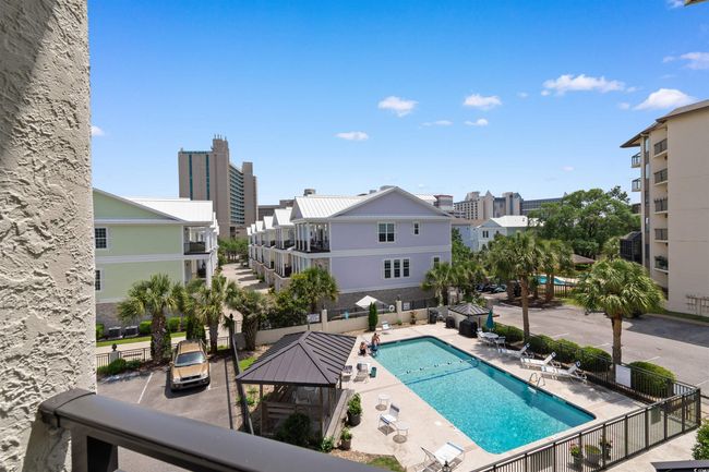 Community pool featuring fence | Image 25