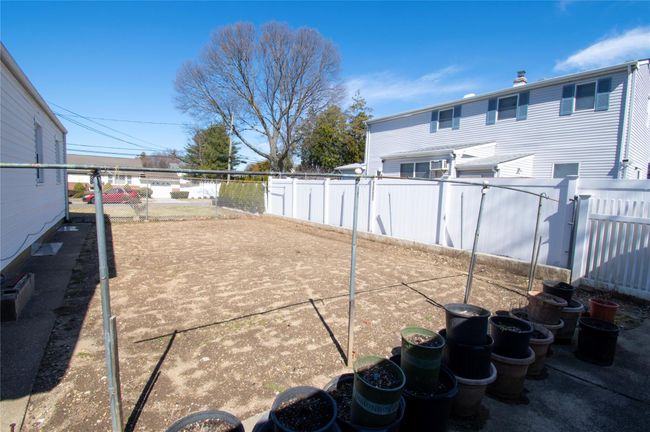View of yard featuring a fenced backyard | Image 26