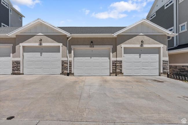 Garage featuring concrete driveway | Image 26