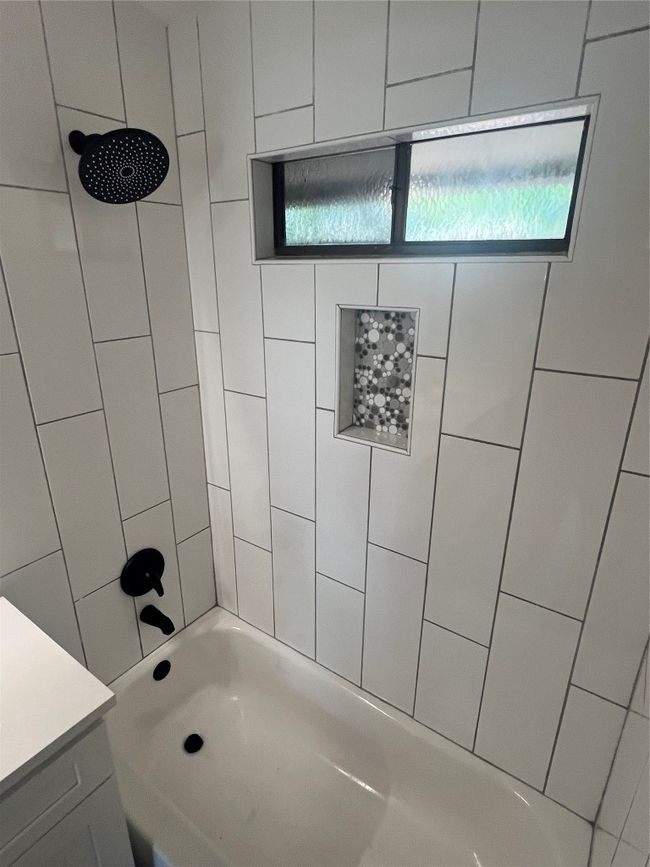Bathroom featuring shower / bath combination and vanity | Image 13