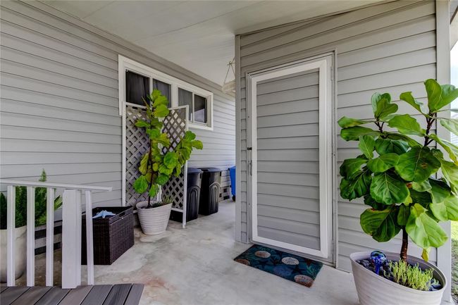 16. Laundry & Storage Shed is Safely Shelted from the Rain Under the Carport Roofing.. Take the Ramp Directly Into It for Laundry Day!. | Image 16