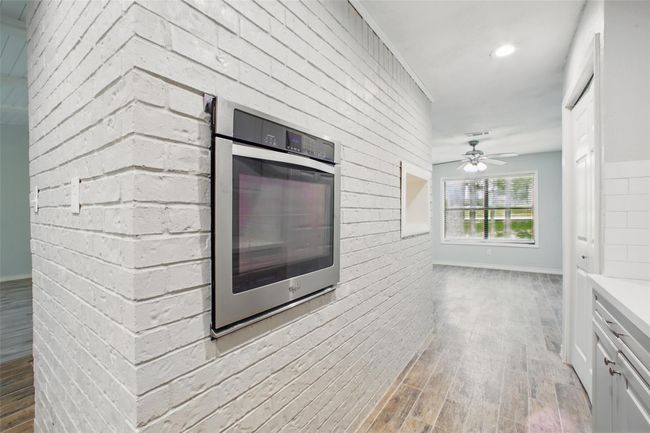 The kitchen’s transitional style blends clean lines with warm finishes—ideal for those who value both form and function. | Image 12