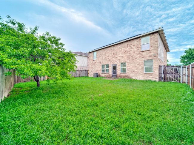 Back of house with central air condition unit and brick siding | Image 31