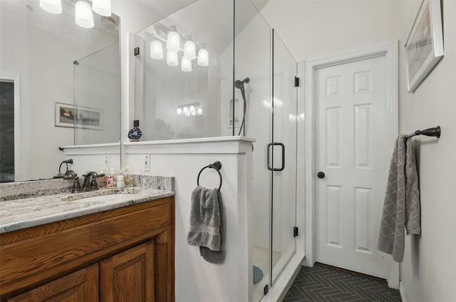 Full bathroom featuring vanity and a shower stall | Image 20