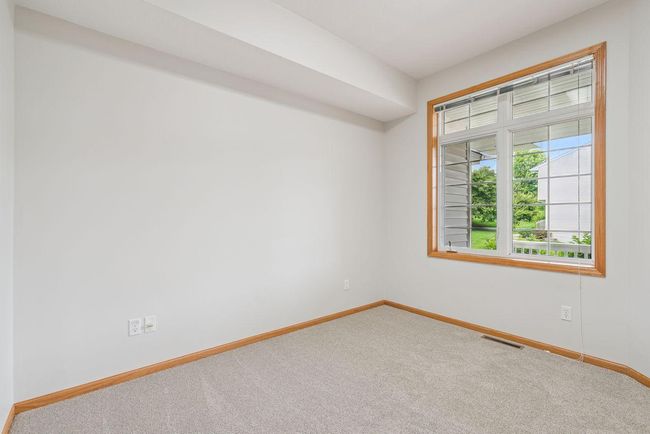 Lower level bedroom, new carpet, new paint, could be an office or flex room | Image 24