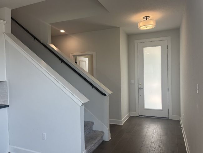 Entryway featuring stairs, baseboards, and dark wood-type flooring | Image 22