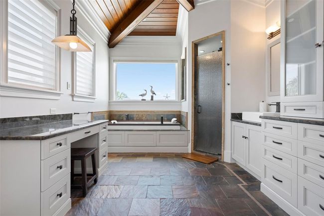 Primary bathroom with dual vanities and soaking tub | Image 47