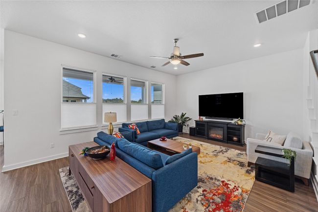 Living area with recessed lighting, baseboards, ceiling fan, visible vents, and wood finished floors | Image 8