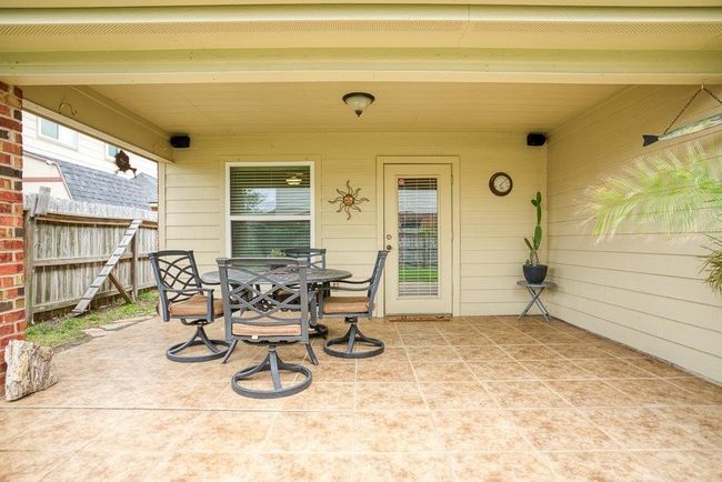 Covered patio wired with sound speakers | Image 33