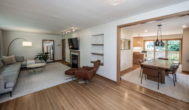 Living room opens to informal dining room | Image 10