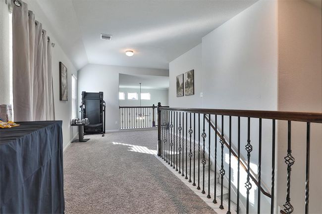 Cross the hall to discover the other secondary bedrooms, each offering comfort and space. | Image 21