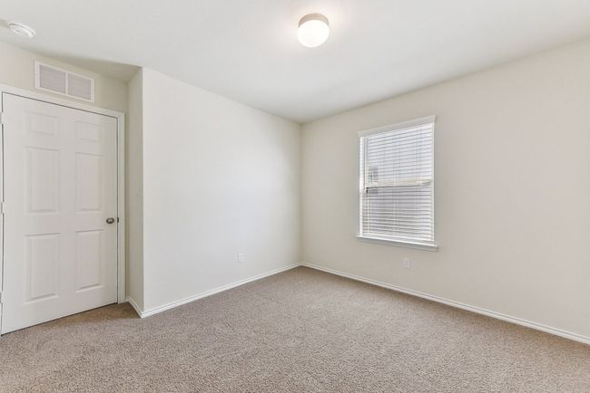Empty room featuring baseboards, carpet flooring, and visible vents | Image 26
