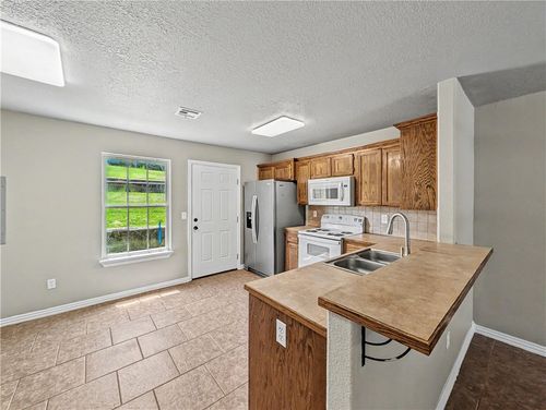 a-703 W Garland St, Siloam Springs, AR, 72761-2635 | Card Image