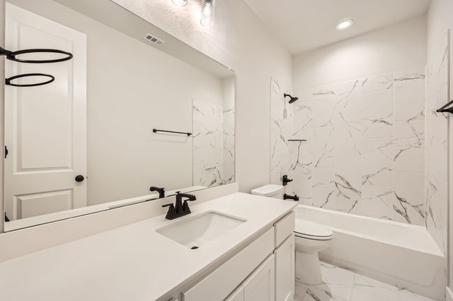 Bathroom with shower / bathing tub combination, vanity, recessed lighting, toilet, and marble finish floor | Image 25