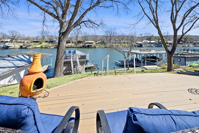 Wooden deck featuring a water view and a boat dock | Image 16