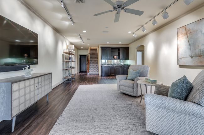 Large Living Room on walk out basement level has wet bar and access via the elevator | Image 30