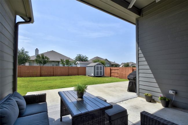 An oversized covered patio is a wonderful place to relax after a long day. | Image 24