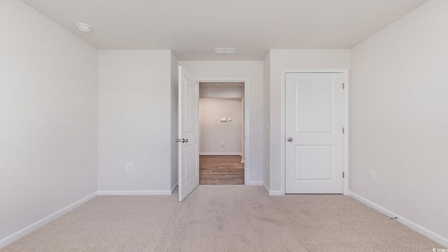 Unfurnished bedroom featuring carpet and baseboards | Image 26