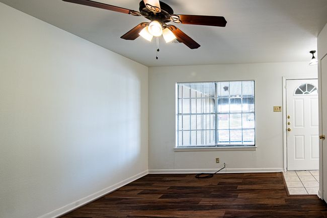 1214 Hunt - Living room with ceiling fan and laminate floors | Image 4