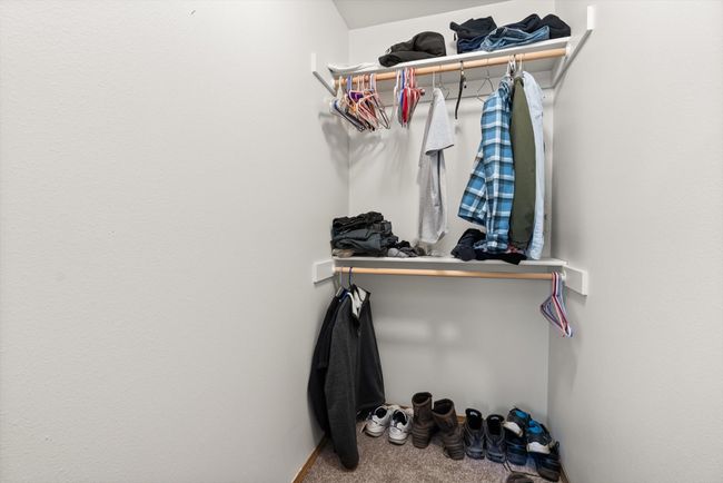 Walk in closet with carpet | Image 26