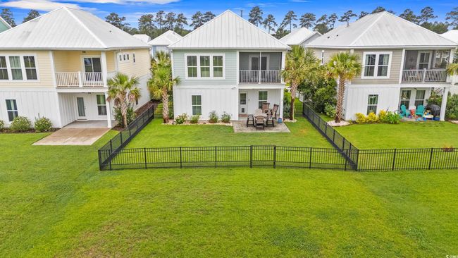 Back of house featuring a patio area, a balcony, and metal roof | Image 31