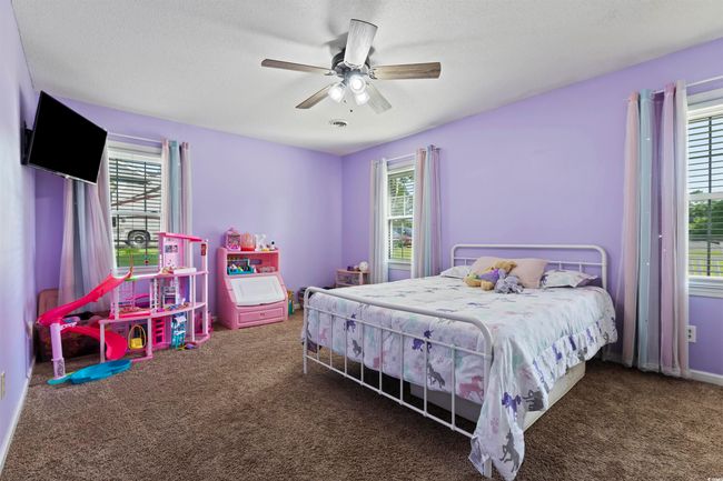 Bedroom featuring carpet flooring and a ceiling fan | Image 17