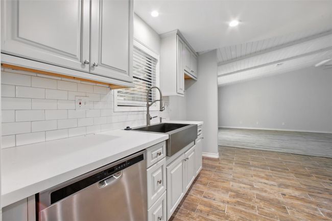 Anchored by a sleek quartz countertop and farm-style sink, this kitchen is the perfect backdrop for meal prep, morning coffee, and everything in between. | Image 8