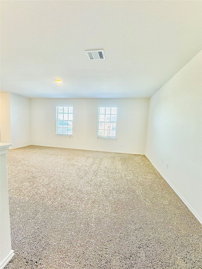 Carpeted spare room featuring baseboards | Image 4