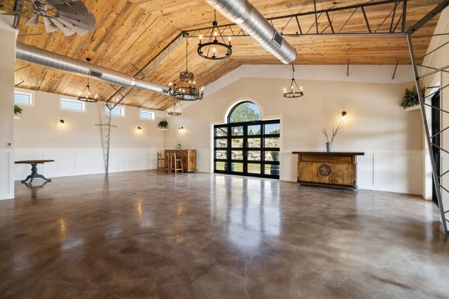 Garage with wood ceiling and wainscoting | Image 6