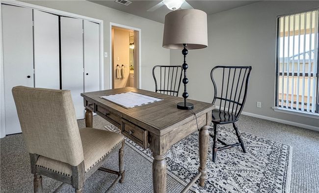 Guest bedroom/Office with patio and access to exterior. | Image 8