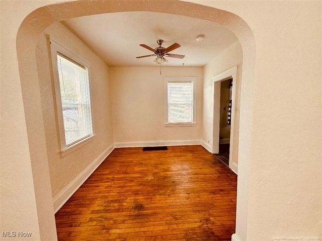 Dining room with new paint and hardwood floors | Image 4
