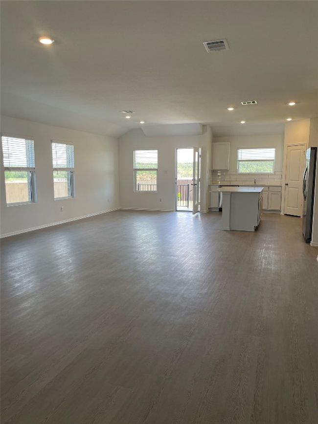 Unfurnished living room featuring recessed lighting, dark wood-type flooring, and baseboards | Image 6