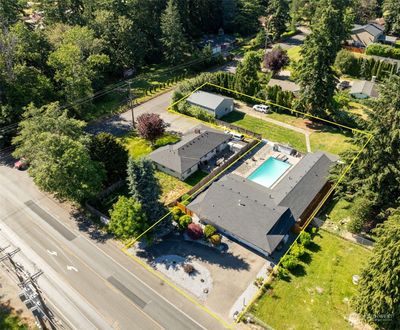 WELCOME HOME! This updated Home features New Roof in 2021, New Exterior Paint in June 2024, Pool, Shop and More! With Access off of 72nd and 44th to the Shop, you can do so much! Pulling in a boat or RV off 44th is easy! | Image 1