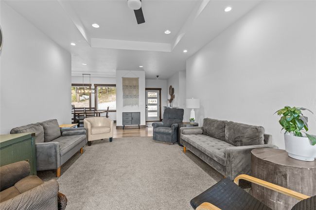 Living room featuring carpet flooring, recessed lighting, and ceiling fan | Image 15